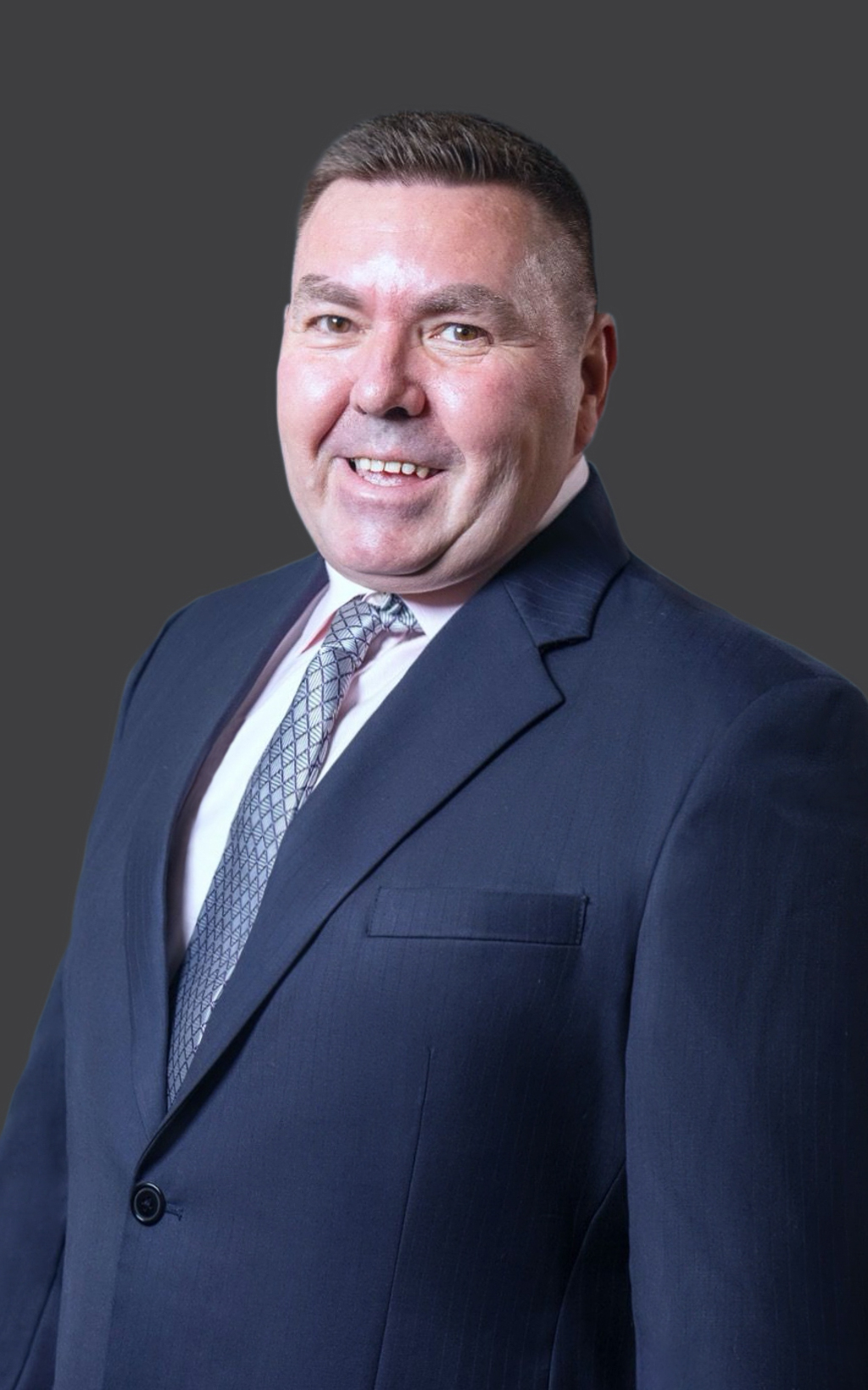 A portrait of Greg Minigle, the Director of EW Property Group.